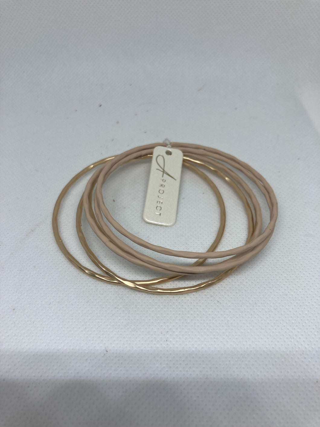 Gold and Beige Metal Bangles